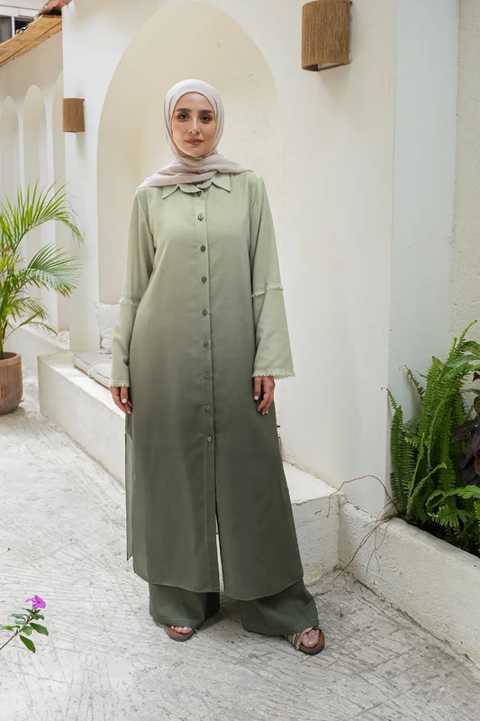 Long button-front modest top worn as part of a two-piece set with matching wide-leg pants, front view