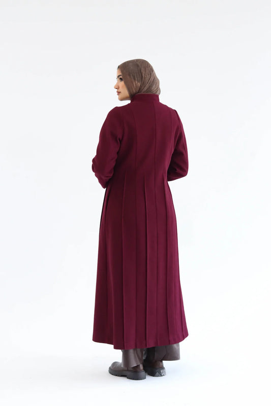 Women’s modest elegant long coat – burgundy lycra wool – back view on model.