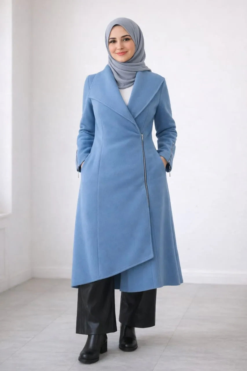 Woman wearing a light blue coat with a gray hijab on a white background