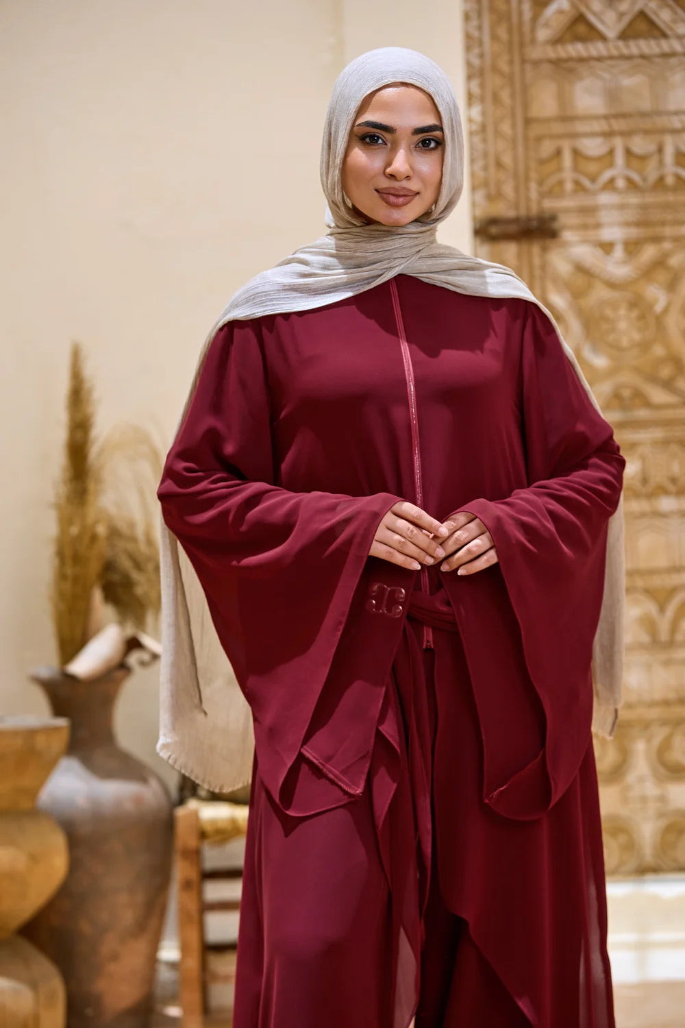 Burgundy layered chiffon tunic with an extended bell sleeve and flowing front panels