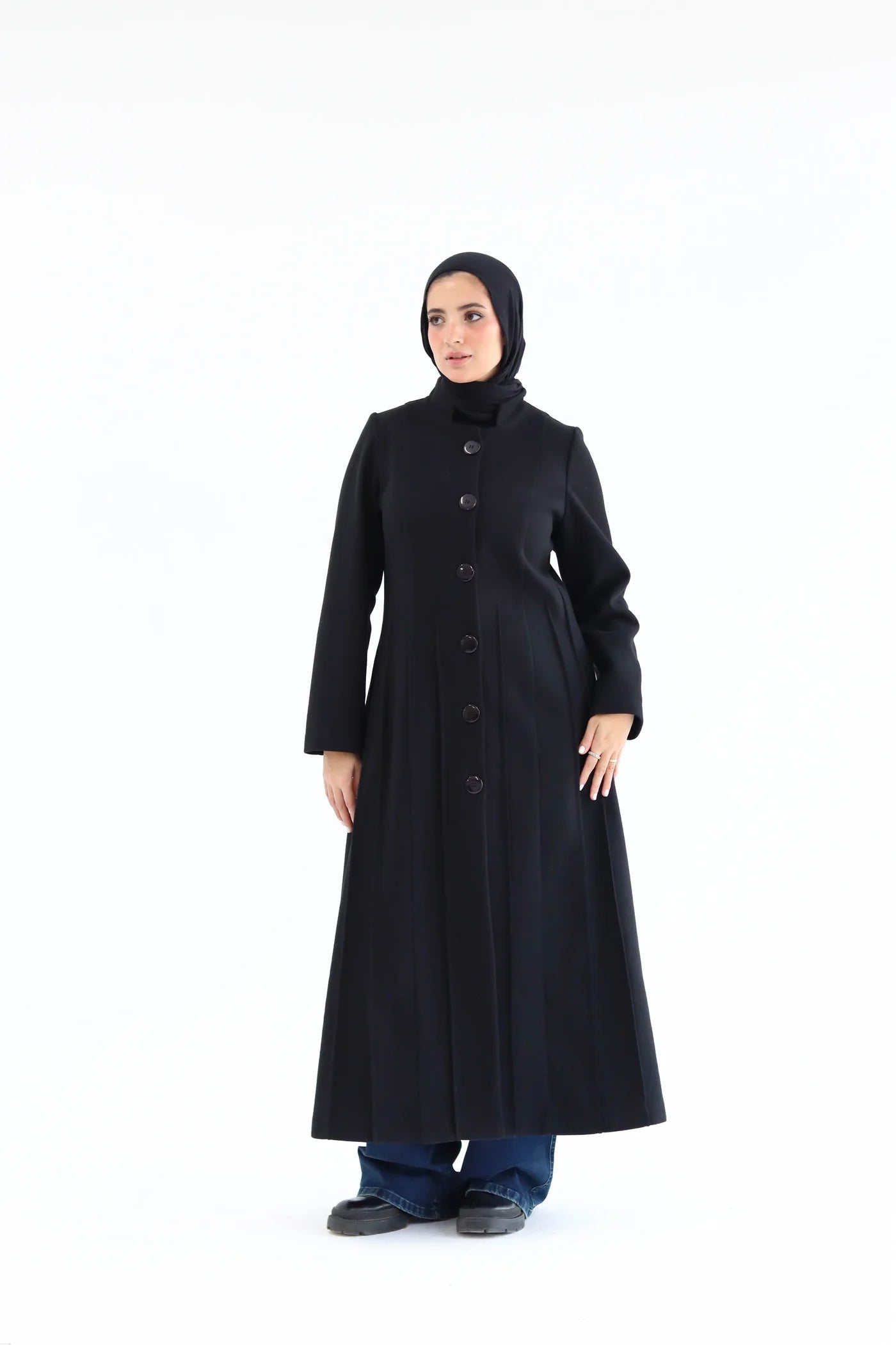 Women’s modest elegant long coat – black lycra wool – front view on model.