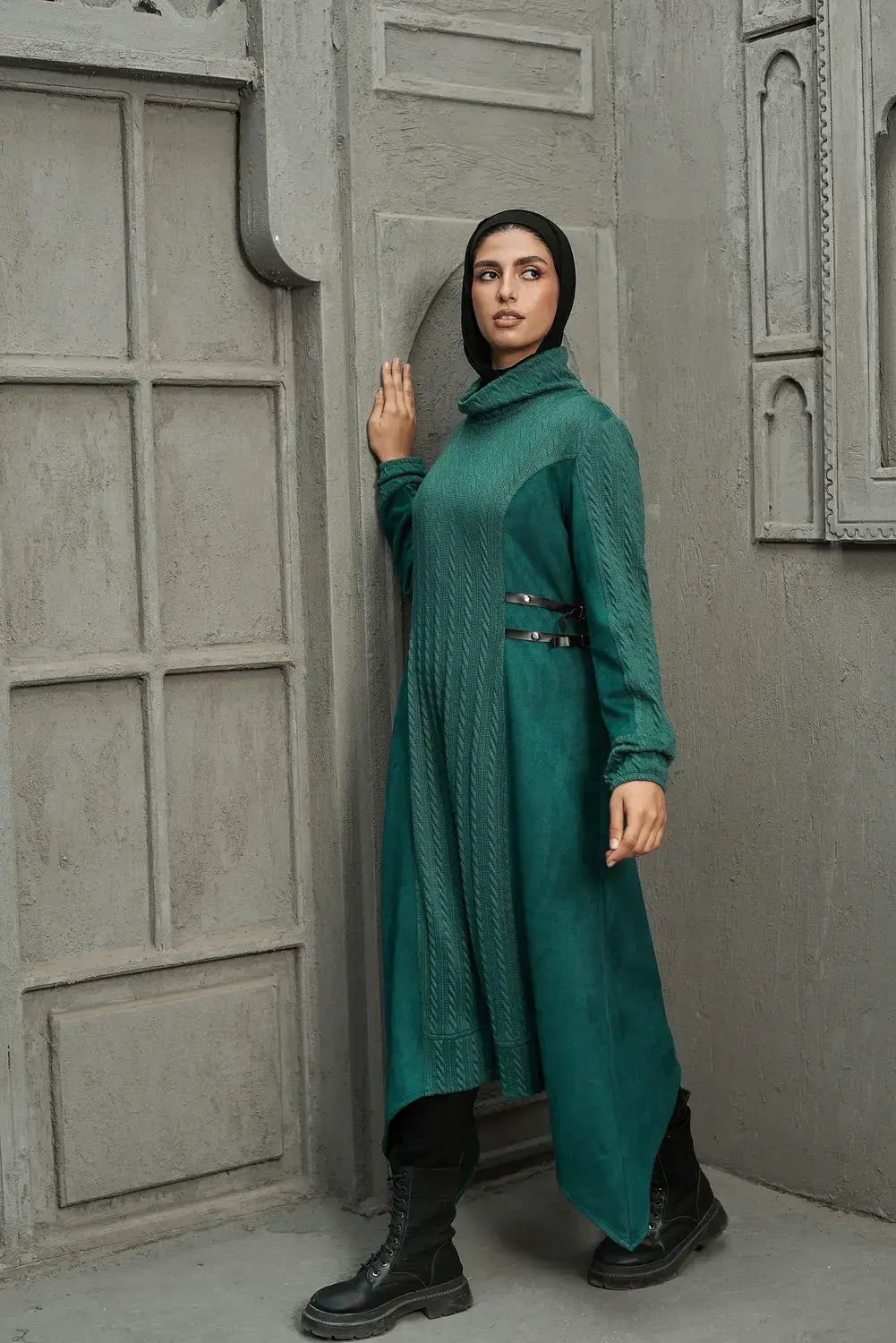 Green knitware dress side view highlighting flowing cut