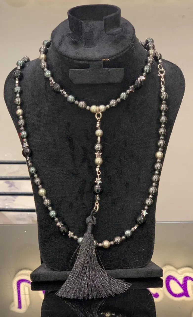Long beaded necklace  pendant on display bust