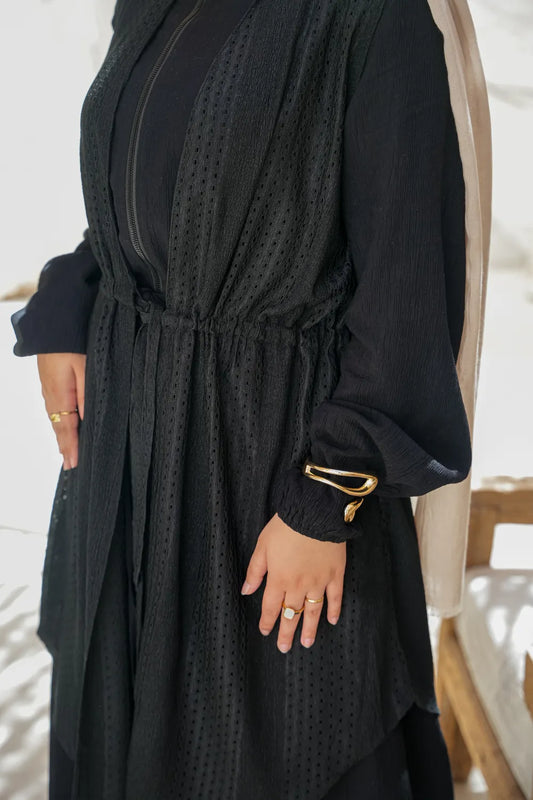 Close-up of modest flow dress fabric showing soft texture and fluid drape
