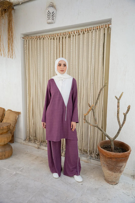 Woman wearing an everyday women’s set with long modest top and matching pants, full body front view