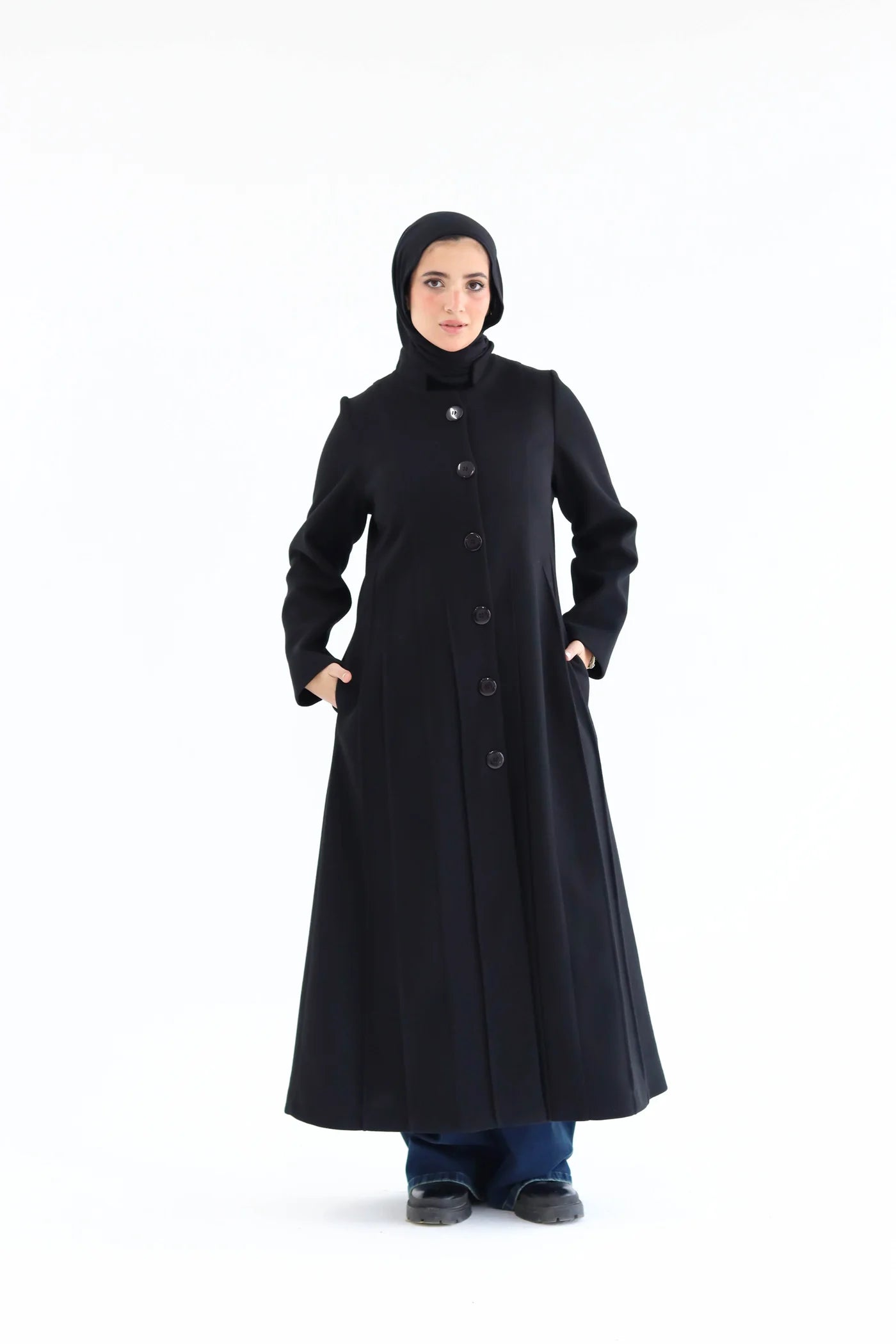 Women’s modest elegant long coat – black lycra wool – front view on model.