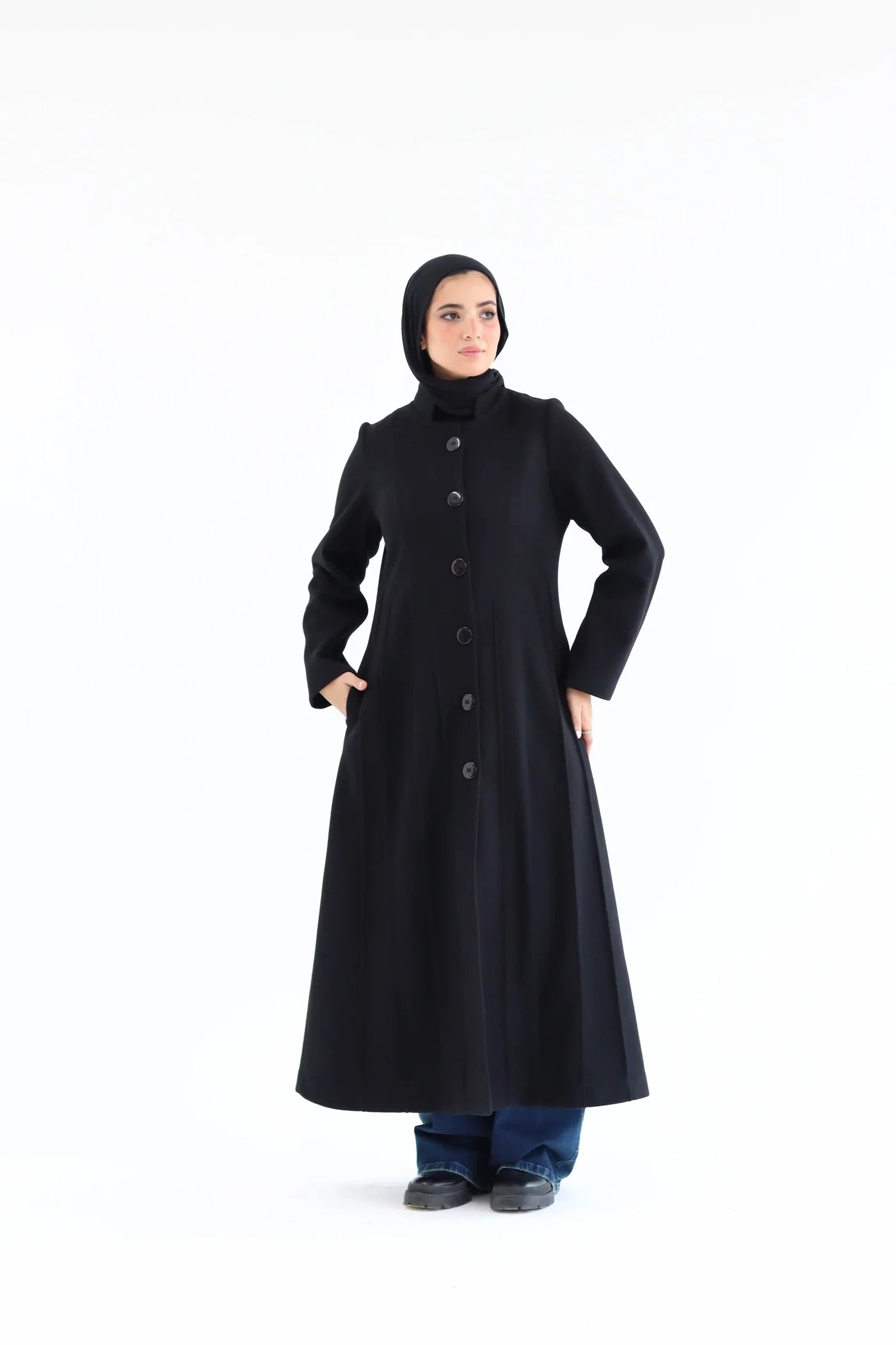Women’s modest elegant long coat – black lycra wool – front view on model.