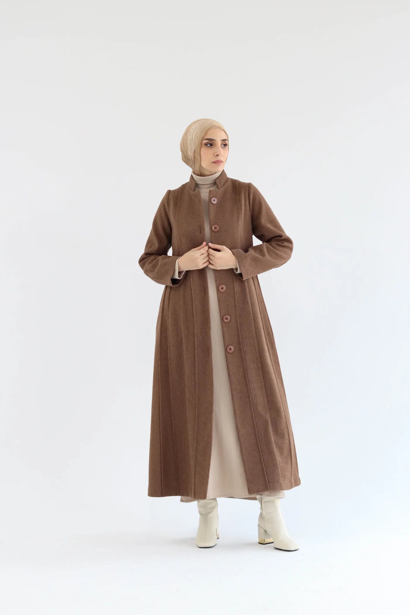 Women’s modest elegant long coat – mocha lycra wool – front view on model.
