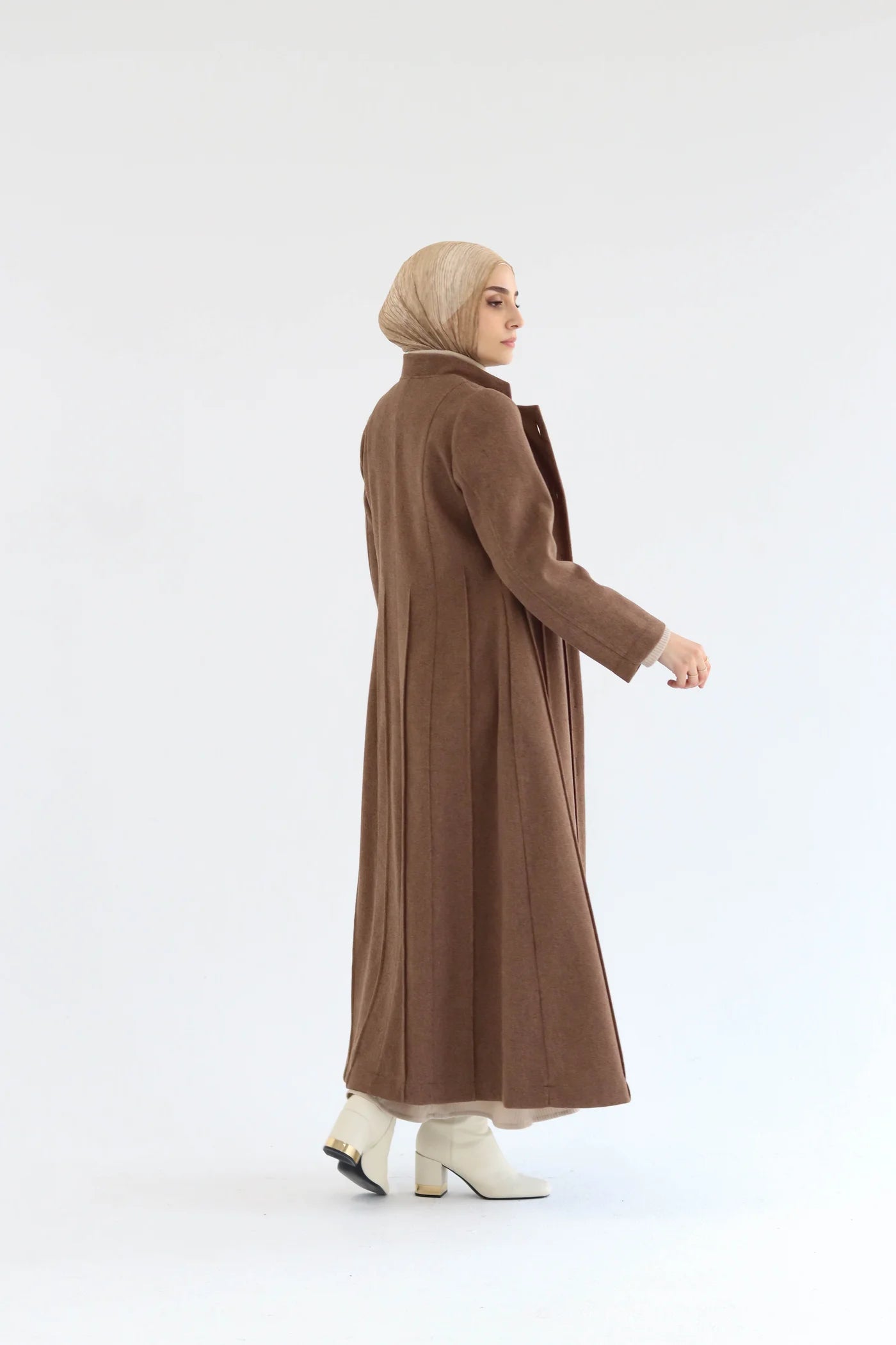 Women’s modest elegant long coat – mocha lycra wool – back view on model.