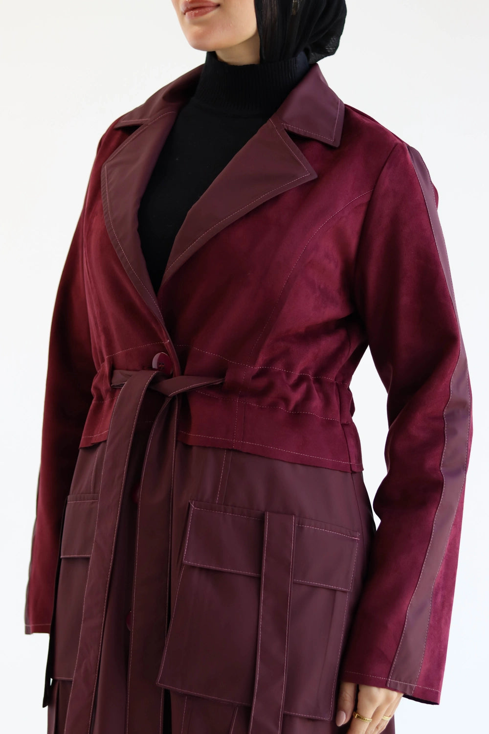 Long suede trench coat with waterproof finish styled for modest winter layering