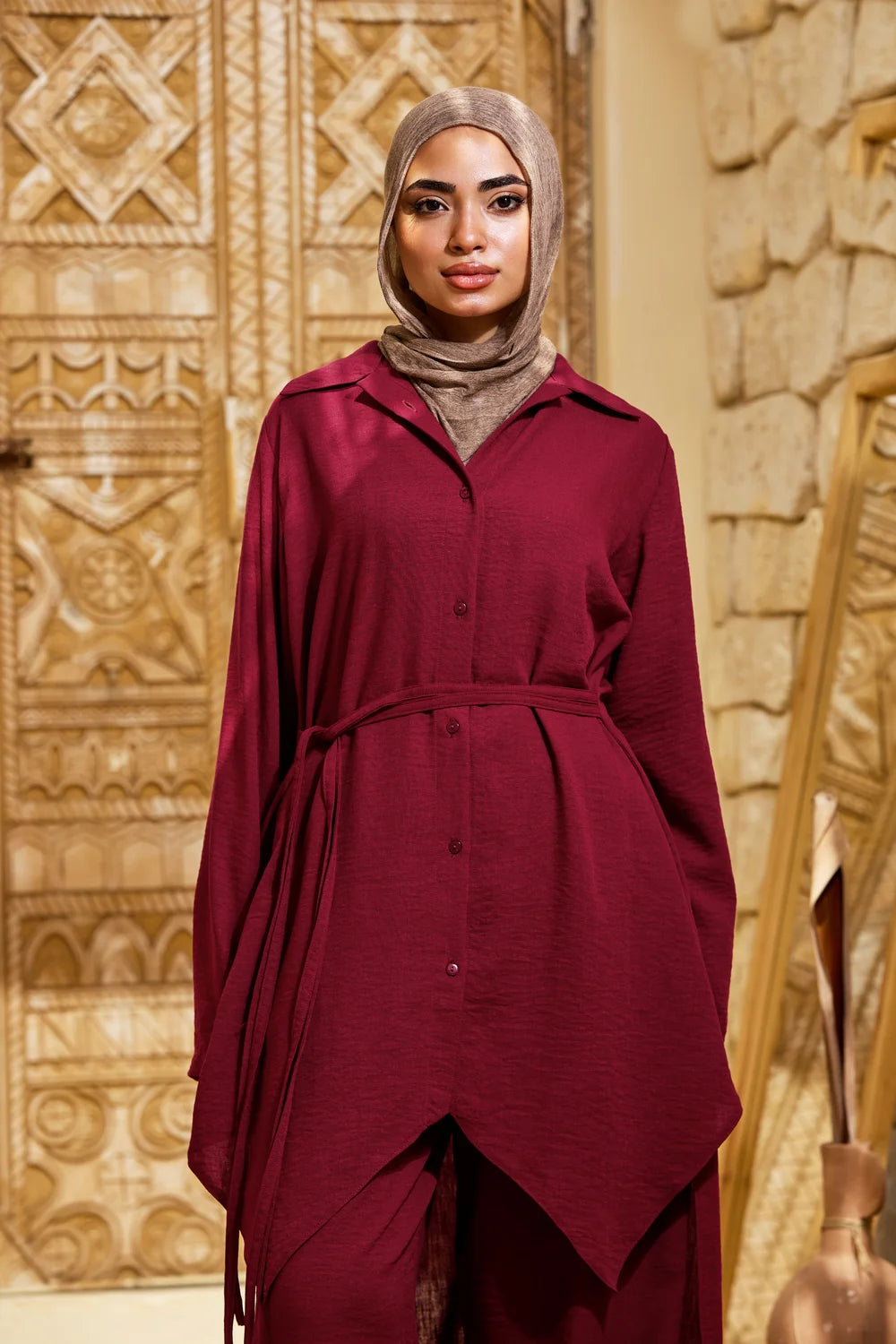 Front view of the burgundy High-Low Triangle Hem Tunic showing the collar, buttons and pointed hem