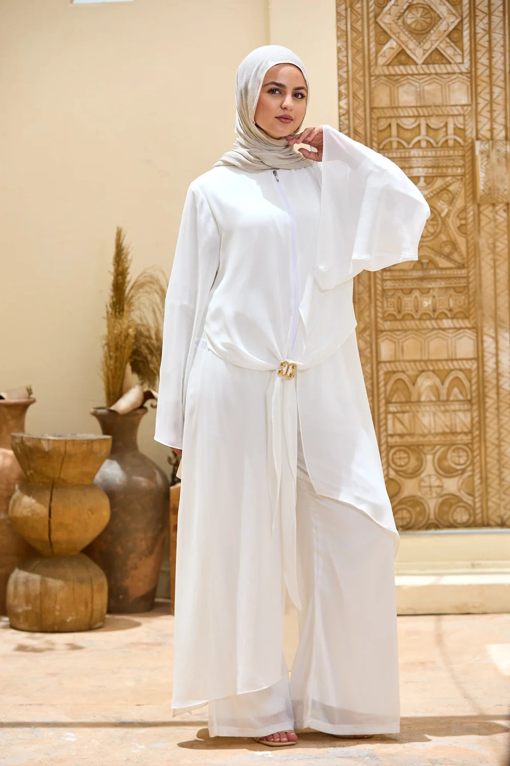 Full-length front view of the white Layered Chiffon Triangle Hem Tunic with flowing sleeves