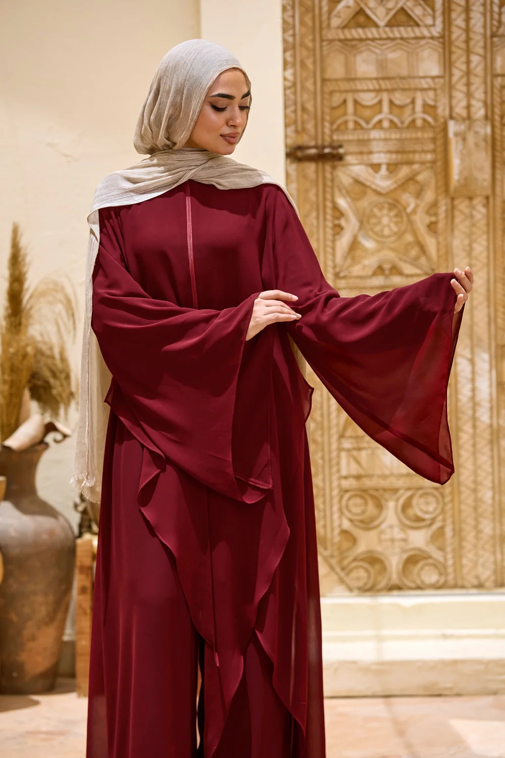Burgundy Layered Chiffon Triangle Hem Tunic showing the wide layered bell sleeve