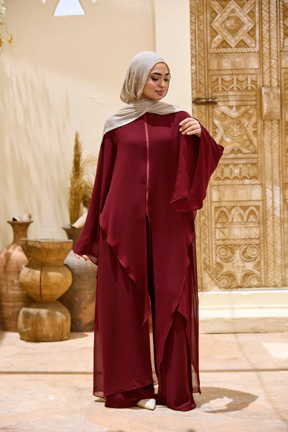 Full-length view of the burgundy Layered Chiffon Triangle Hem Tunic in a flowing silhouette