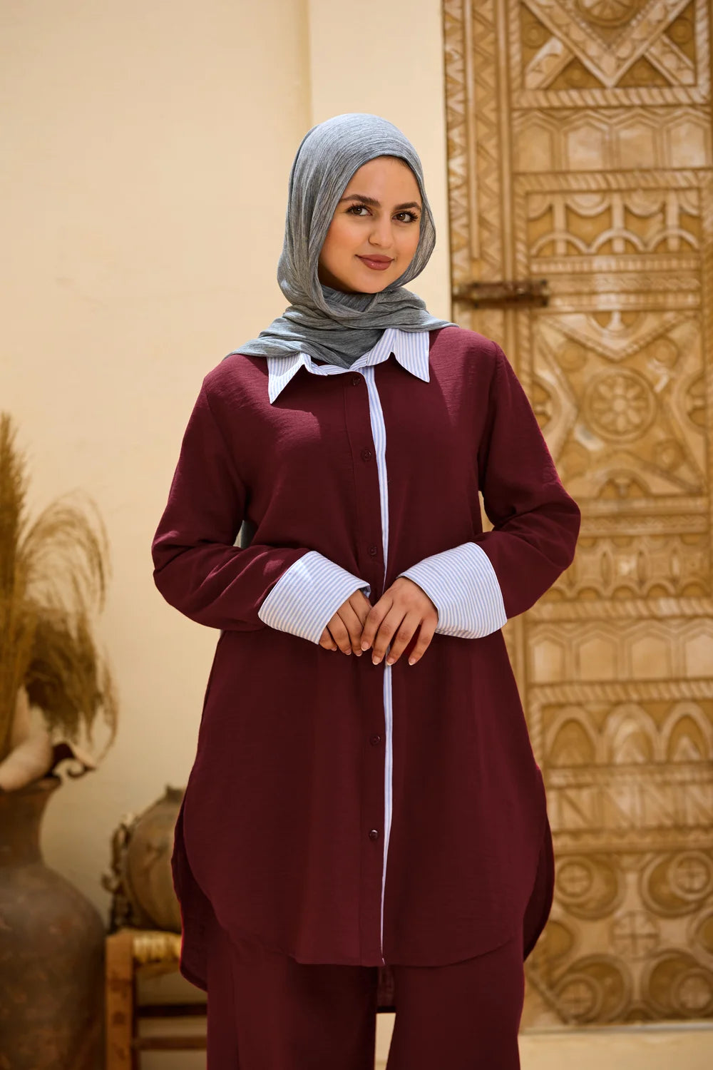 Full-length front view of the burgundy Linen Shirt with Striped Details and matching trousers
