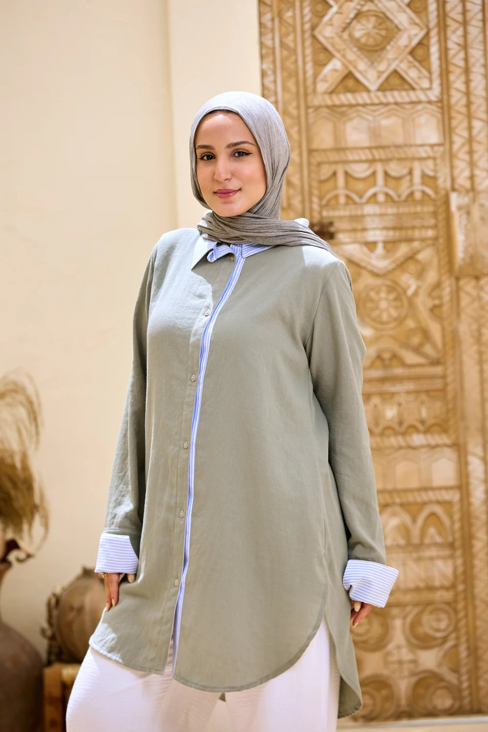 Front view of the army green Linen Shirt with a striped collar, button placket and cuffs