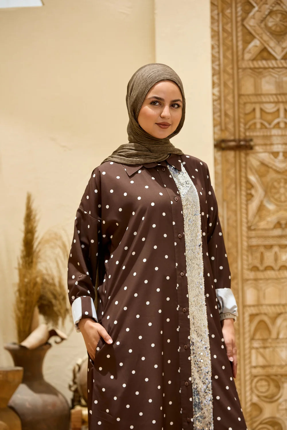 Brown polka dot maxi shirt dress showing the sequin front panel and long sleeves, upper-body view