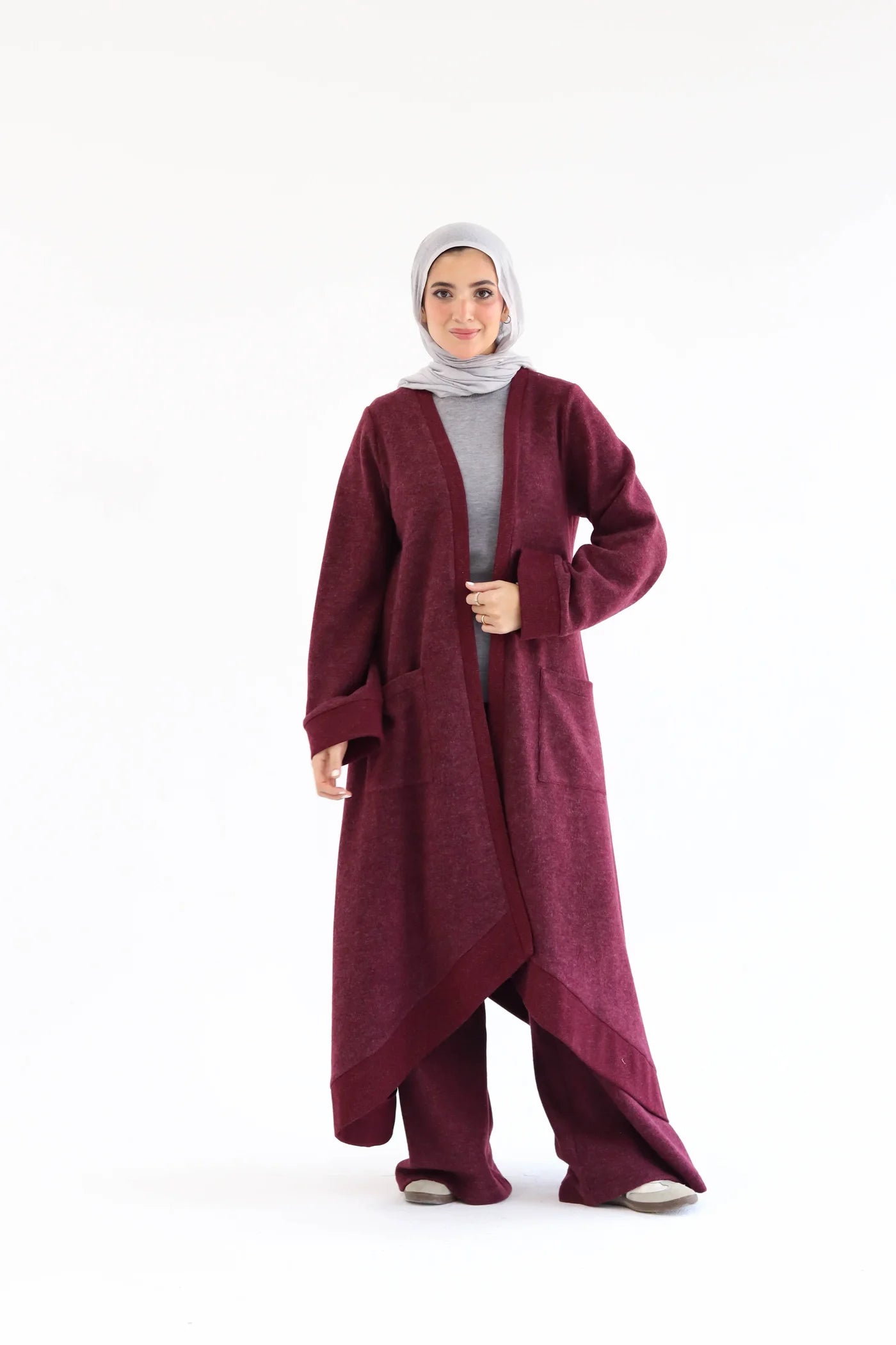 Burgundy knitted cardigan set featuring a long open cardigan, wide-leg pants, and straight relaxed fit, front full-length view.
