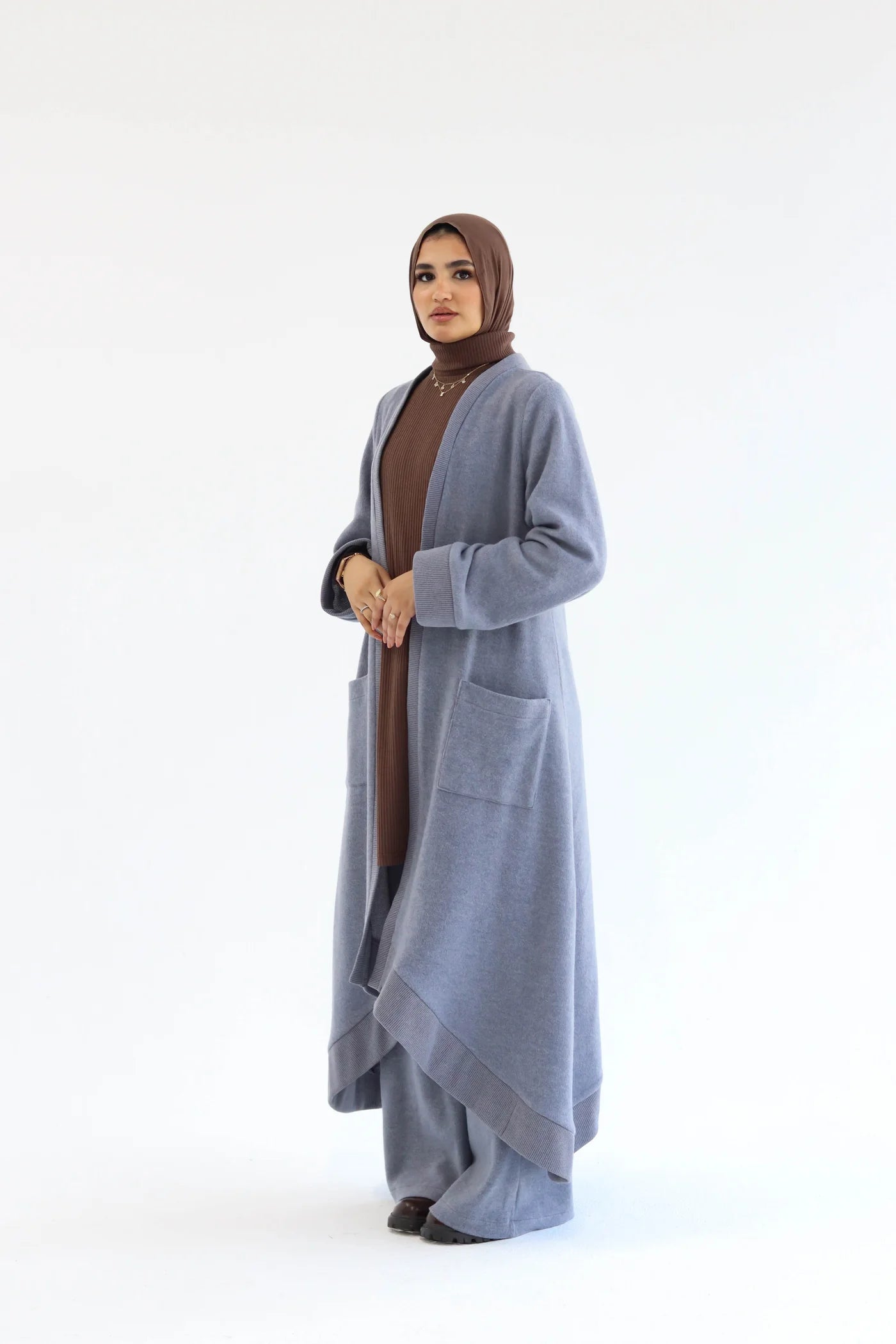 Blue knitted cardigan set with long open cardigan and wide-leg pants, full-length front view.