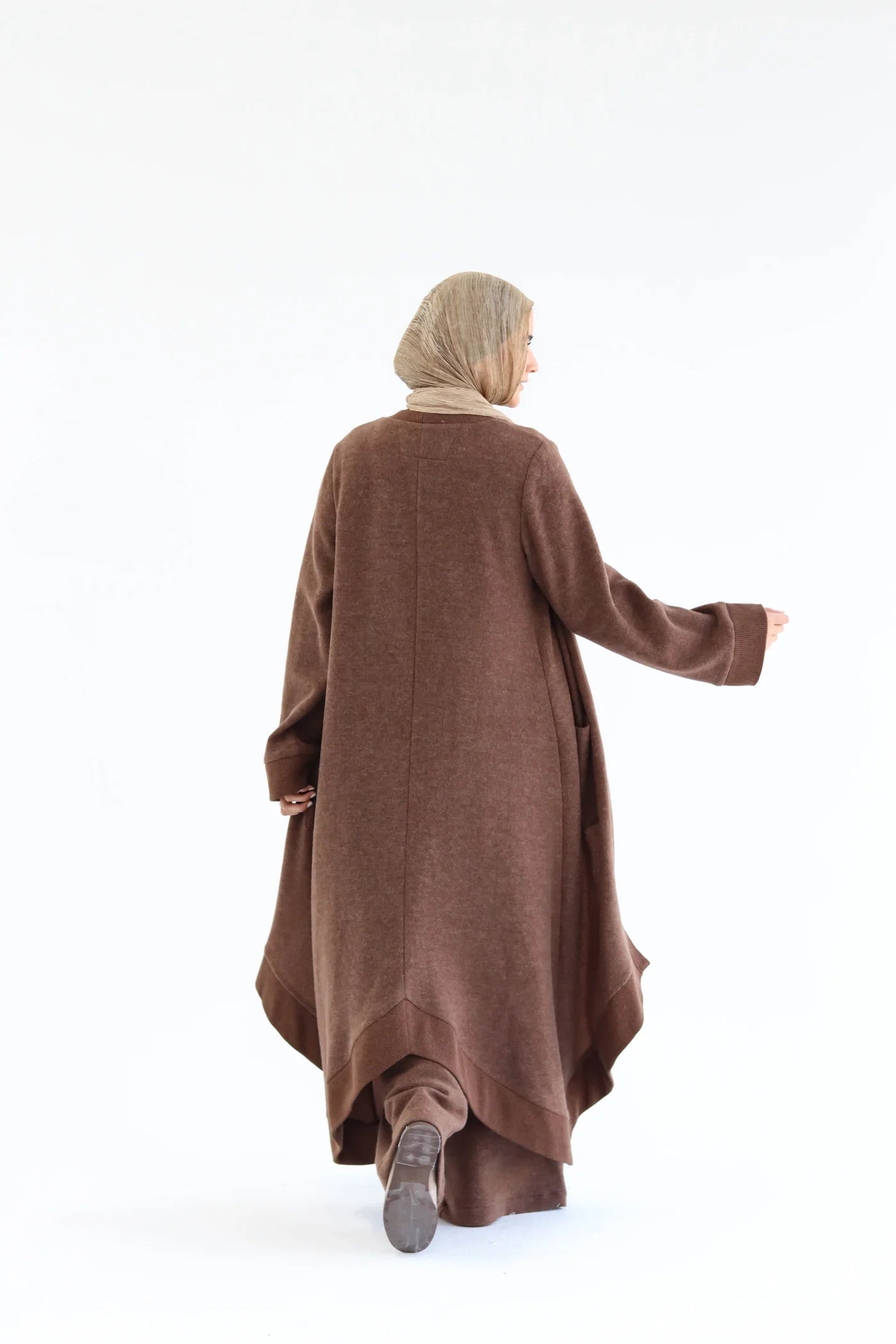 Back view of brown cardigan set showing straight fall of the cardigan and wide-leg pants.