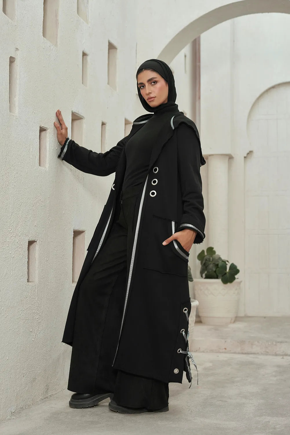 Women’s modest stylish black corsage cardigan – summer melton with waterproof leather strap – front view on model.