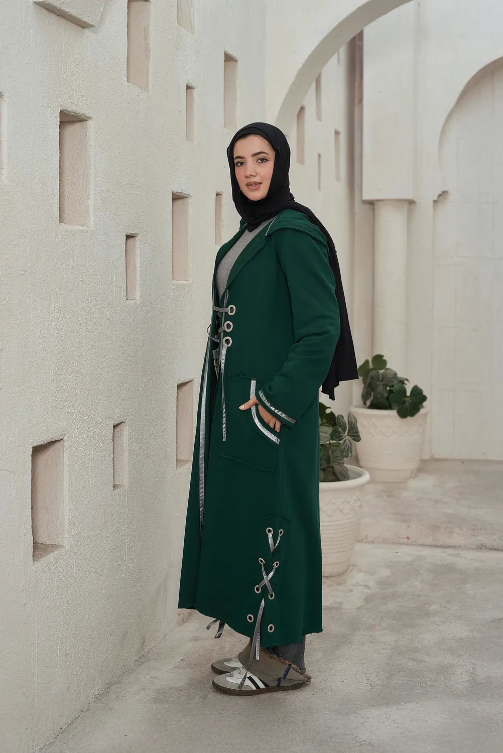  Women’s modest stylish olive corsage cardigan – summer melton with waterproof leather strap – side view on model.