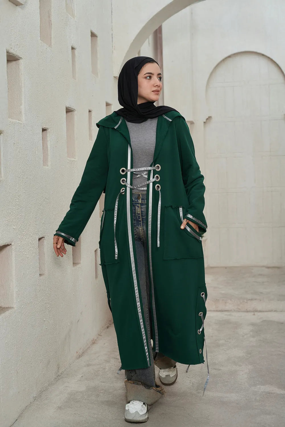 Women’s modest stylish olive corsage cardigan – summer melton with waterproof leather strap – front view on model.