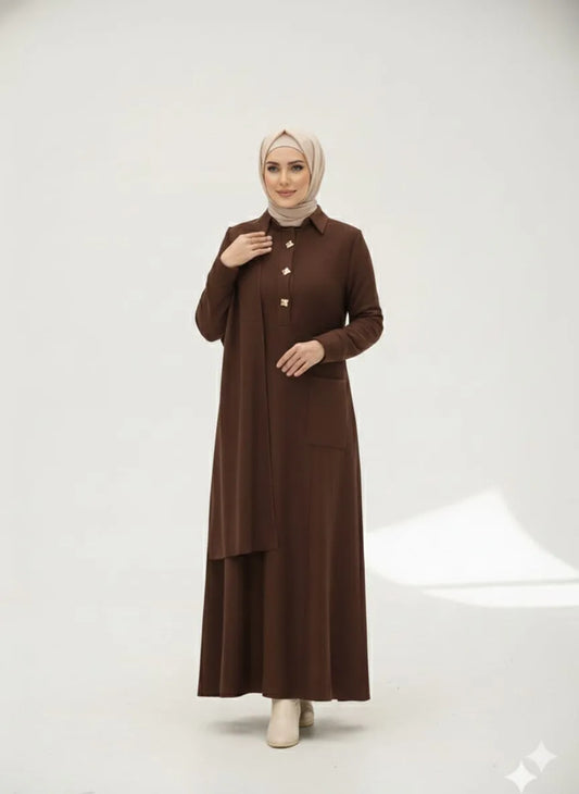 Woman wearing a brown dress with a matching hijab on a white background