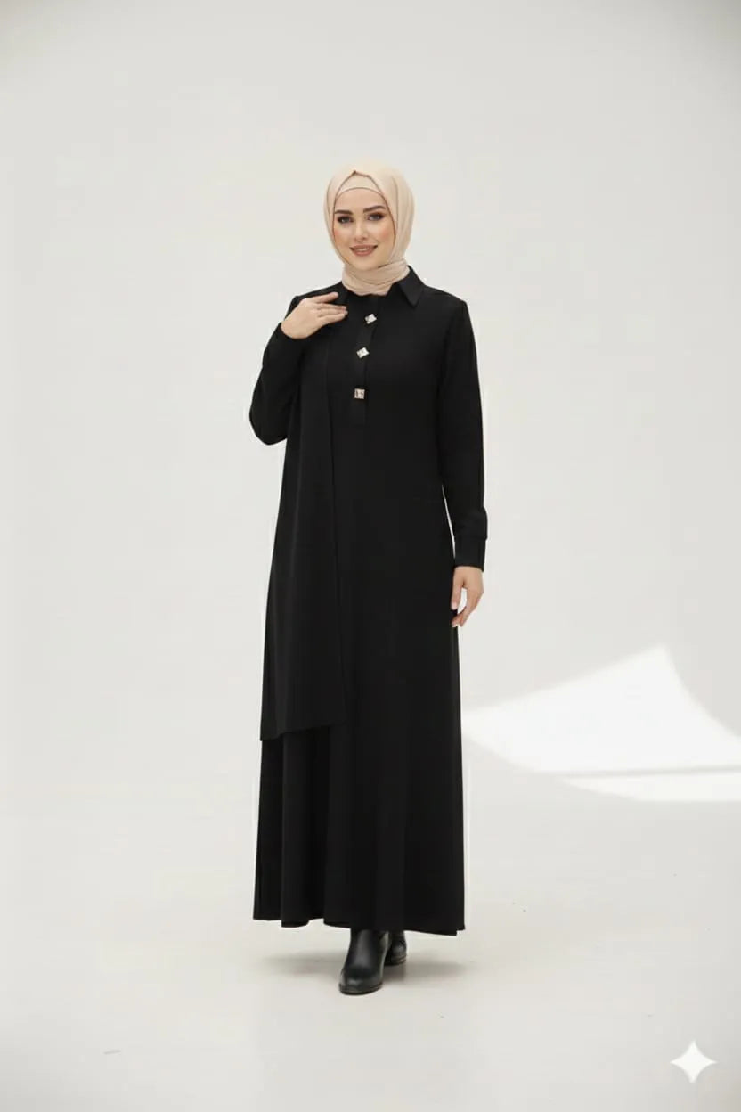Woman in a hijab wearing a black dress with a high collar on a white background