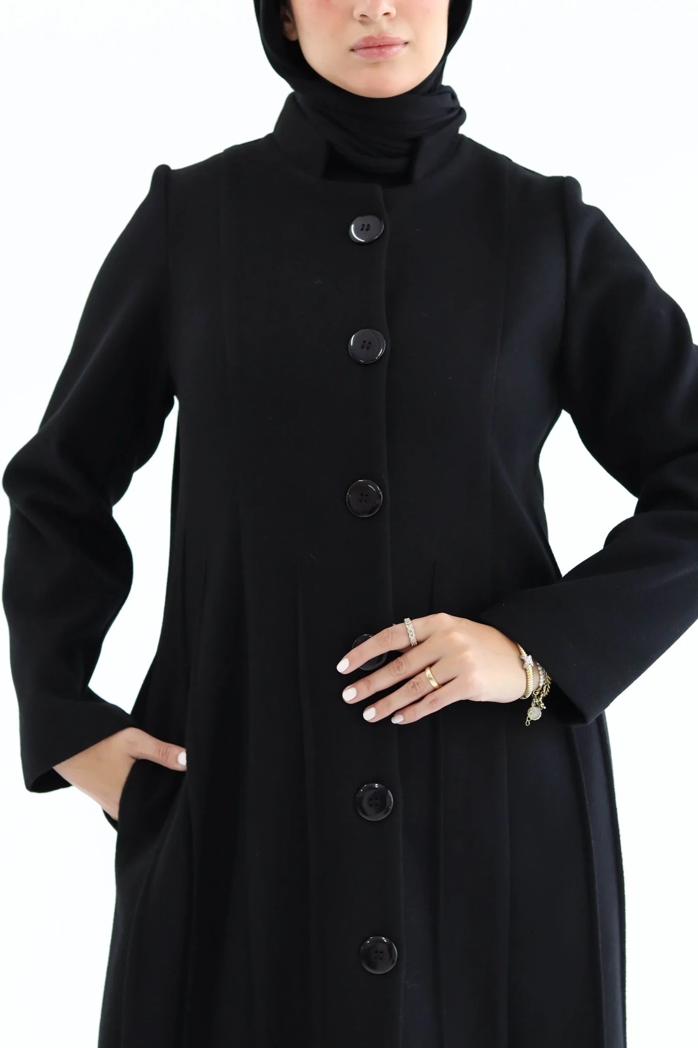 Women’s modest elegant long coat – black lycra wool – front view on model.