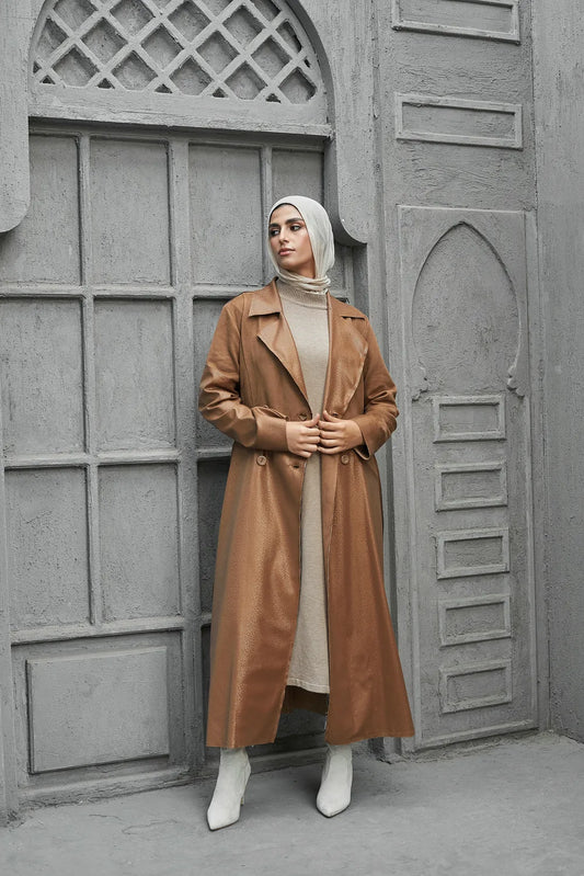 Women’s modest stylish caramel-beige trench coat – snake print leather and suede – full length front view on model.”