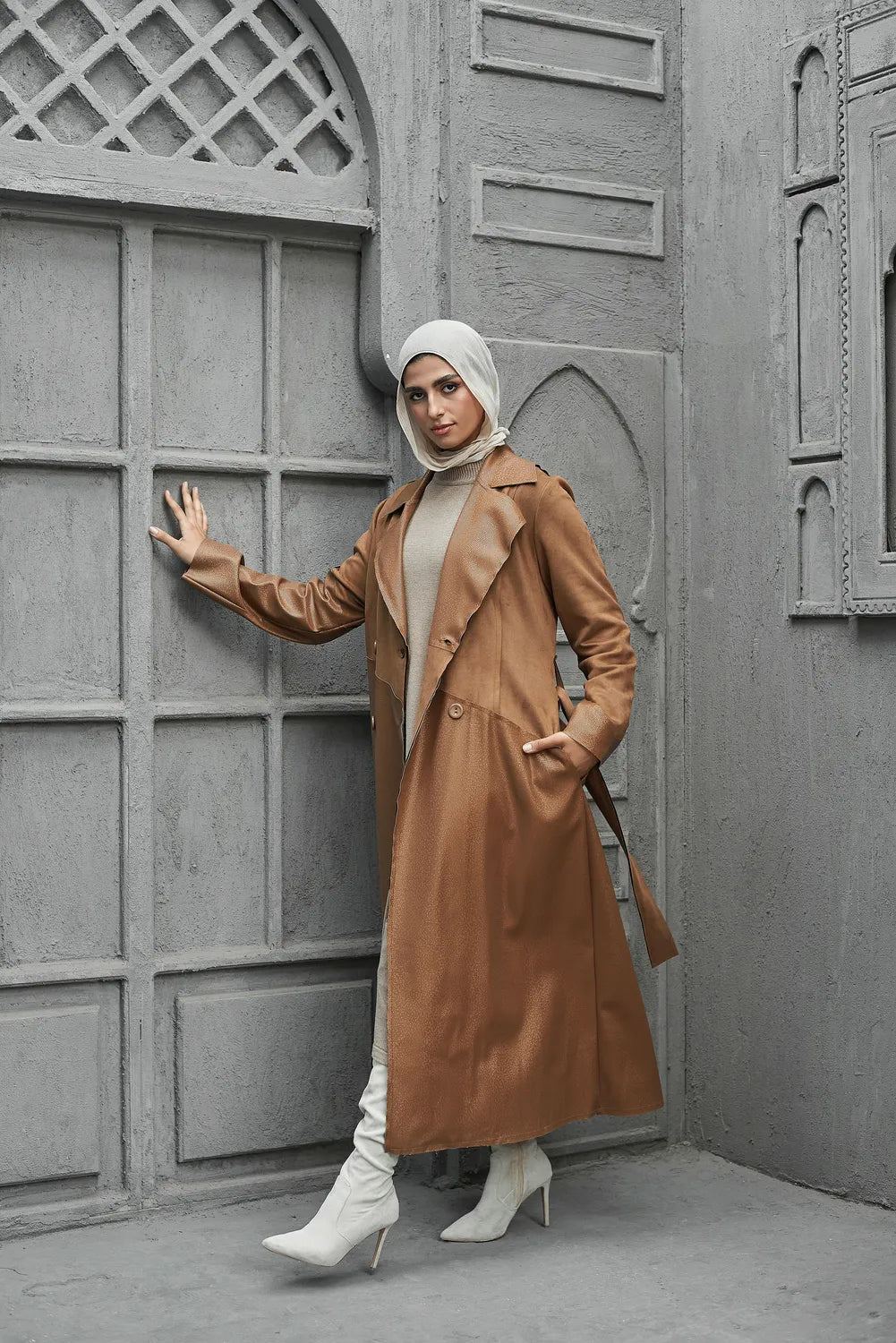 Women’s modest stylish caramel-beige trench coat – snake print leather and suede – side view on model